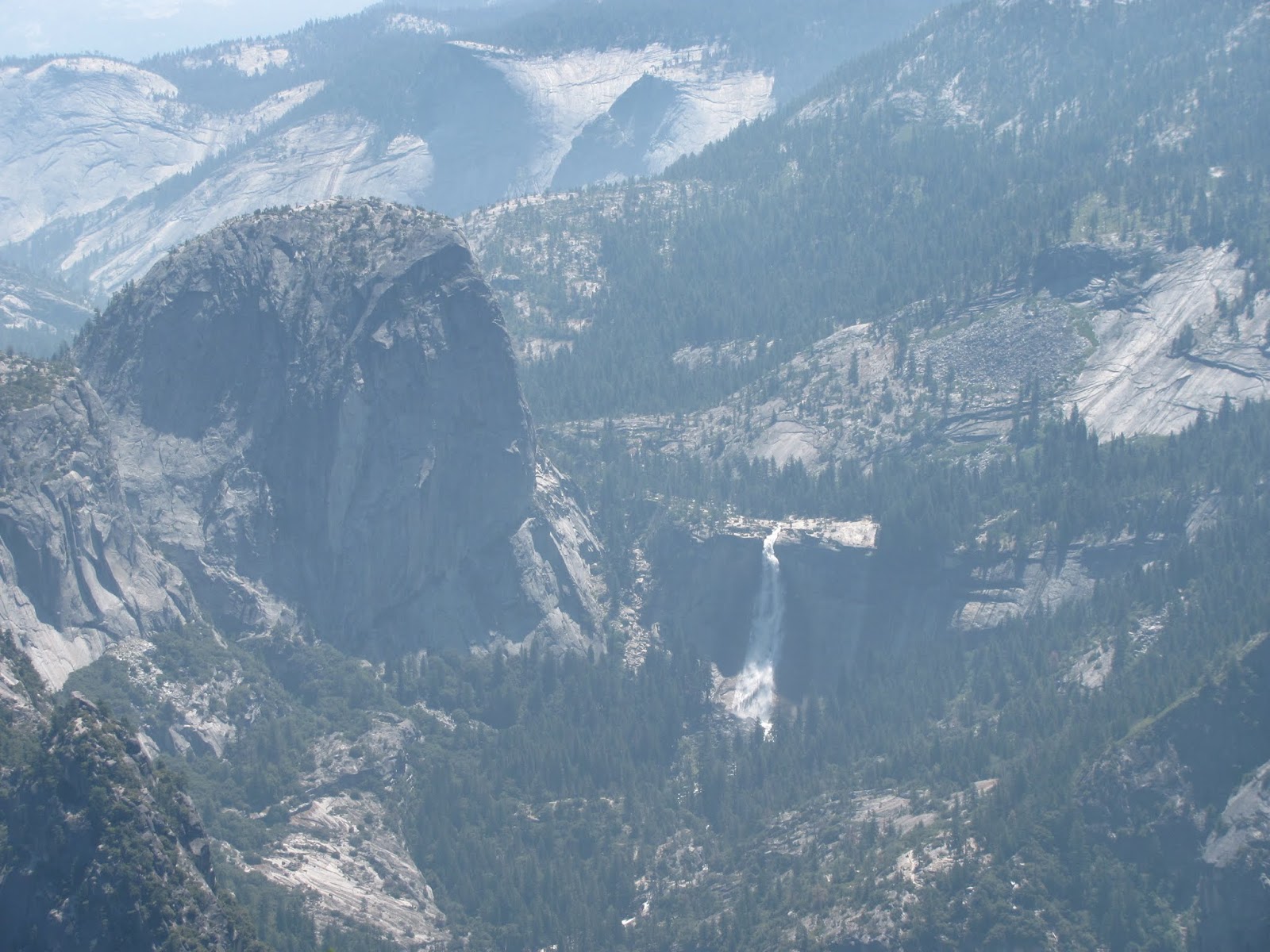 One More Green trees cover the Yosemite Valley floor viewed from Glacier Point in Yosemite National Park, California