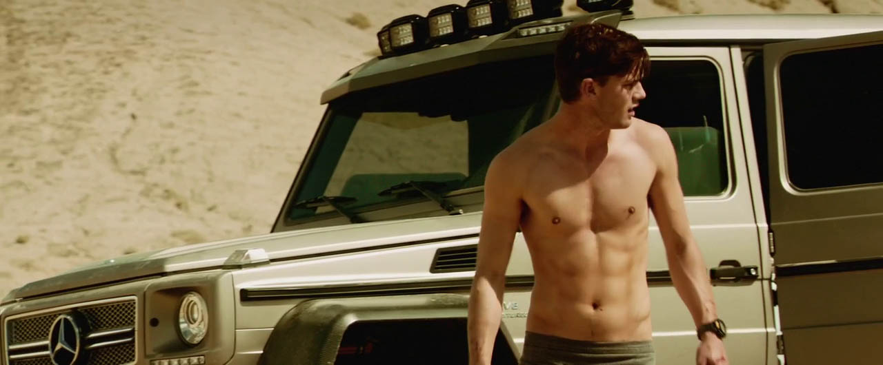 Jeremy Irvine shirtless in Beyond The Reach.