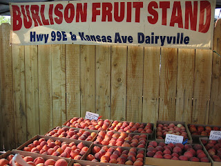 Flats of juicy peaches from the Burlison Fruit Stand, Dairyville, CA