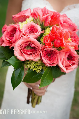 Close up of the bride holding a pink bouquet