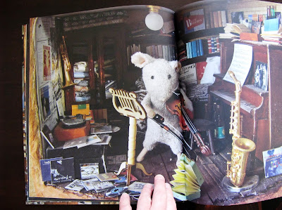 Inside spread from the book 'Mouse Mansion: Sam and Julia", showing a mouse playing the violin in a miniature music room.