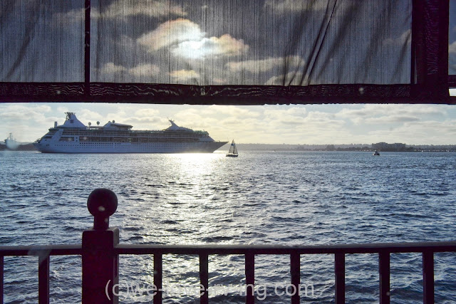 Bright sun is setting over the cruise ship