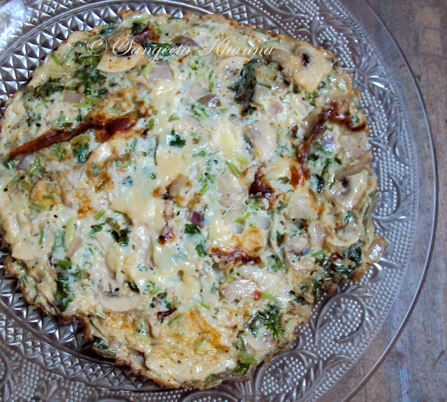 cheese omelet with refreshing flavors...Mushrooms, Celery and rosemary...