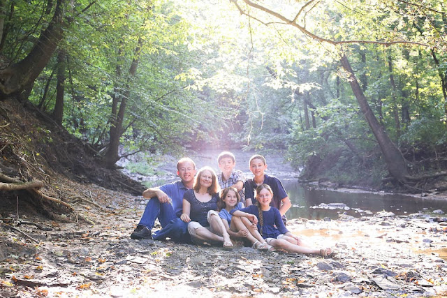 family by stream with backlight
