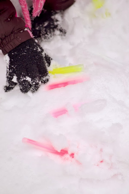 Play with glow sticks in the snow for a simple and fun activity this Winter