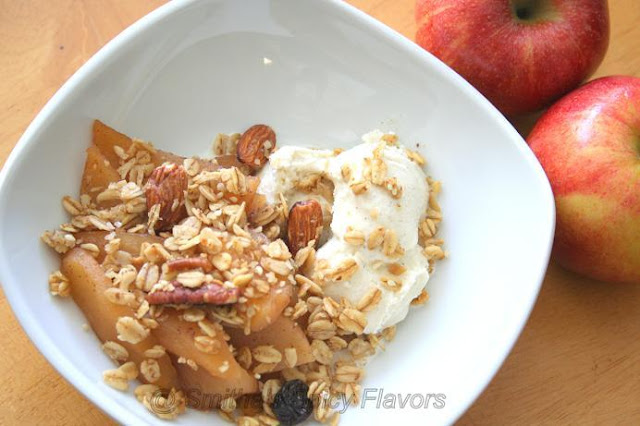 warm spiced apples with nutty granola topping with ice cream aka instant apple crisp