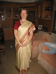 Wearing a sari.