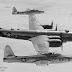 a wing tip to wing tip coupling to get fighter/recon planes in the bombing region with less fuel used, worked. The reduced drag made up for the increased weight