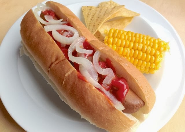 Vegan Hot Dog with tortilla chips and corn on the cob