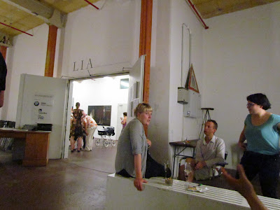 several artists sitting together in a studio