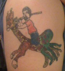 tatuaje montando una jirafa con tentáculos de pulpo