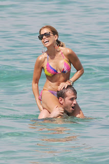 Sylvie Van Der Vaart fooling around in water with her husband