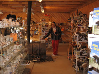 The Chicken Mercantile offering many unusual gift and souvenir items. It is heated by a wood burning barrel stove.