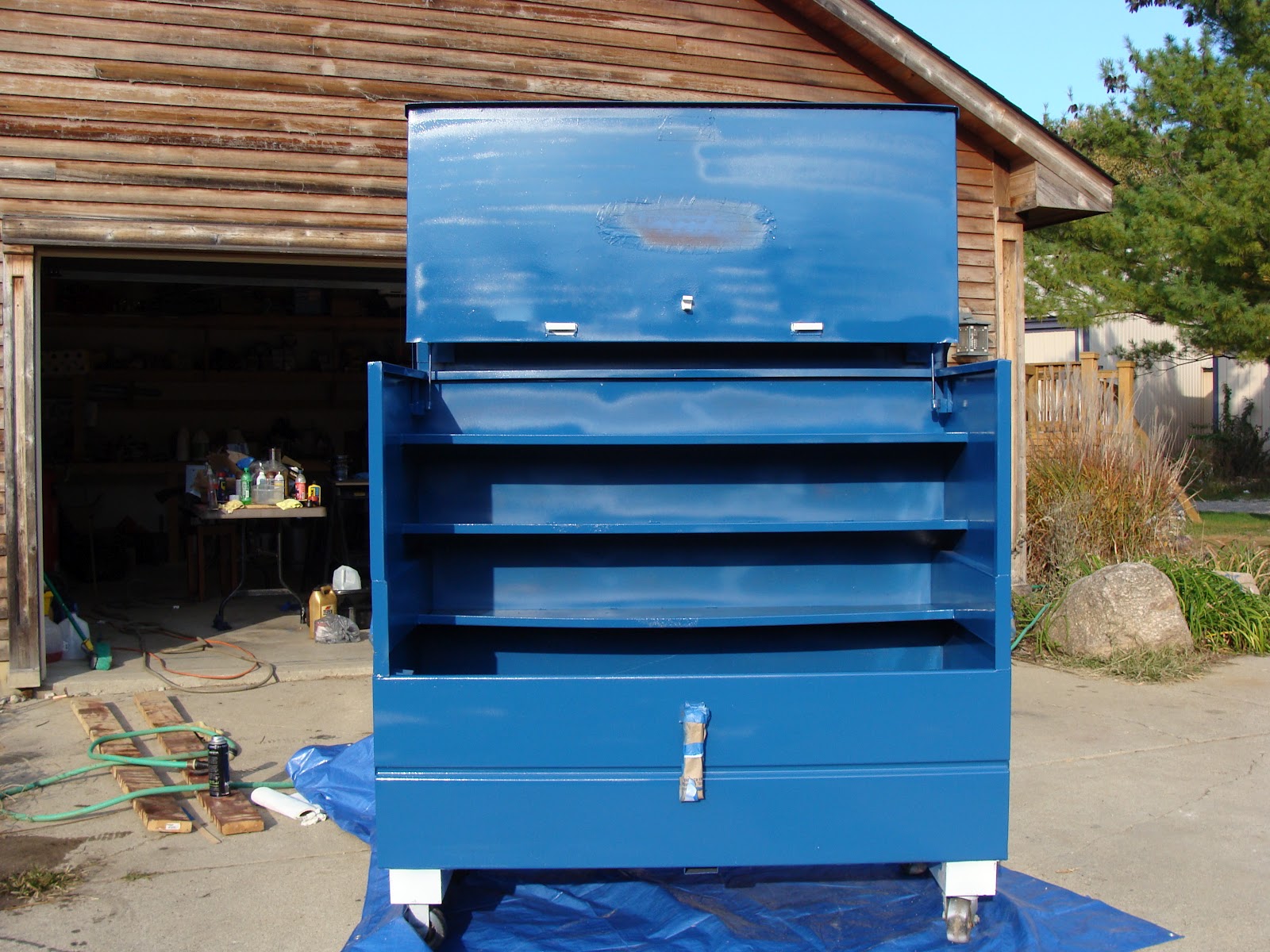 Owen Family Six Spray Painting A Tool Box