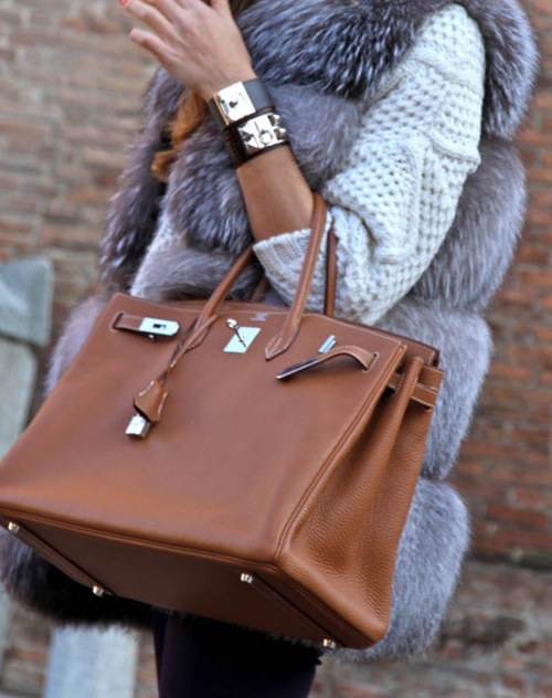 WHAT EVERY WOMAN NEEDS WHAT TO BUY NOW A CLASSIC CAMEL HANDBAG