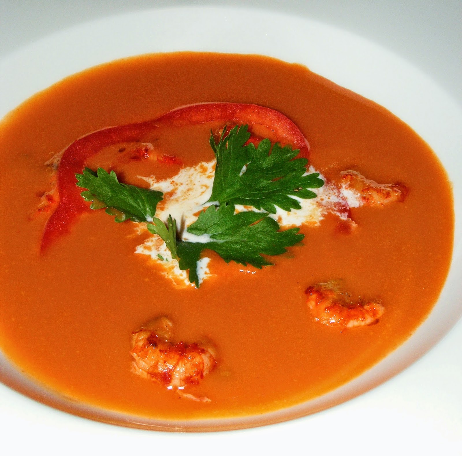 Crawfish Red Pepper Tomato Bisque Served with Artichoke Cream Cheese