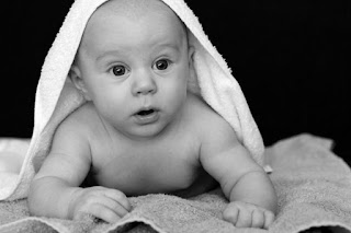 Baby under towel