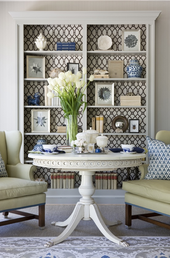 a perfect gray wallpapered bookcase backs...