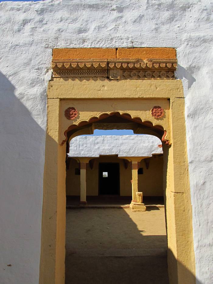 Kuldhara village near Jaisalmer has a very unique history! It is said that the residents of 84 neighboring villages including Kuldhara vacated the villages overnight around 170 years back!! No one is sure where they have gone, but they are believed to have migrated to a place somewhere near Jodhpur. The residents were Paliwal Brahmans — said to be very intelligent, and residing there for about 500 years. So what made them do such an act? Stories say that the ruler of these villages pounded the Paliwals with heavy taxes and treated them very inhumanly; the ruler was unethical and forceful to them. They had no alternative, but to vacate all the 84 villages overnight and just disappear from the vision and reach of the ruler.  When the Paliwals left the villages, they left a curse that nobody can inhabit the villages ever. Residents of Jaisalmer say that there have been some attempts by some families to stay there, but they did not succeed.