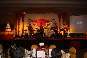 The Evergreen band on stage performing for the function