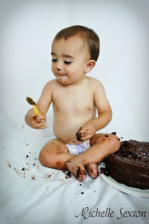 Baby eating cake with spoon