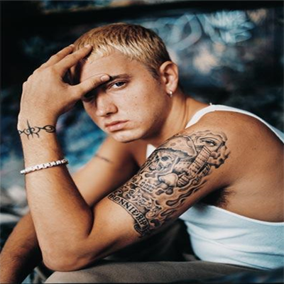 Tattoo Description Eminem got this upper left shoulder tattoo as a 