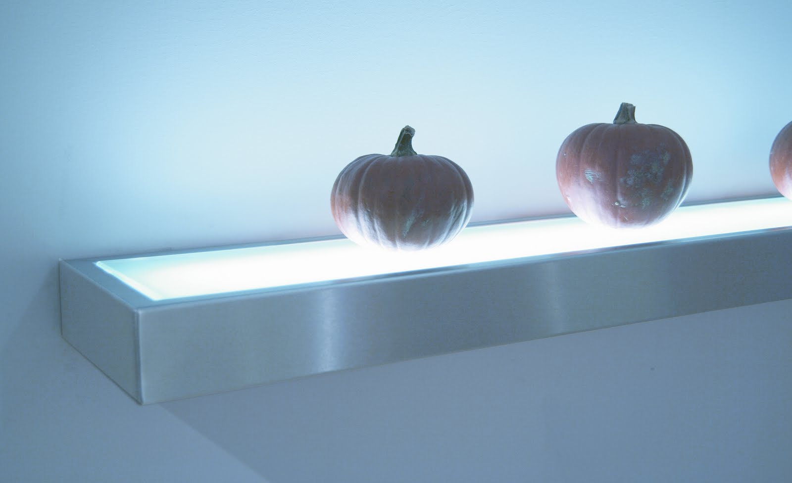 Let the shelves illuminate your way into the pantry or closet