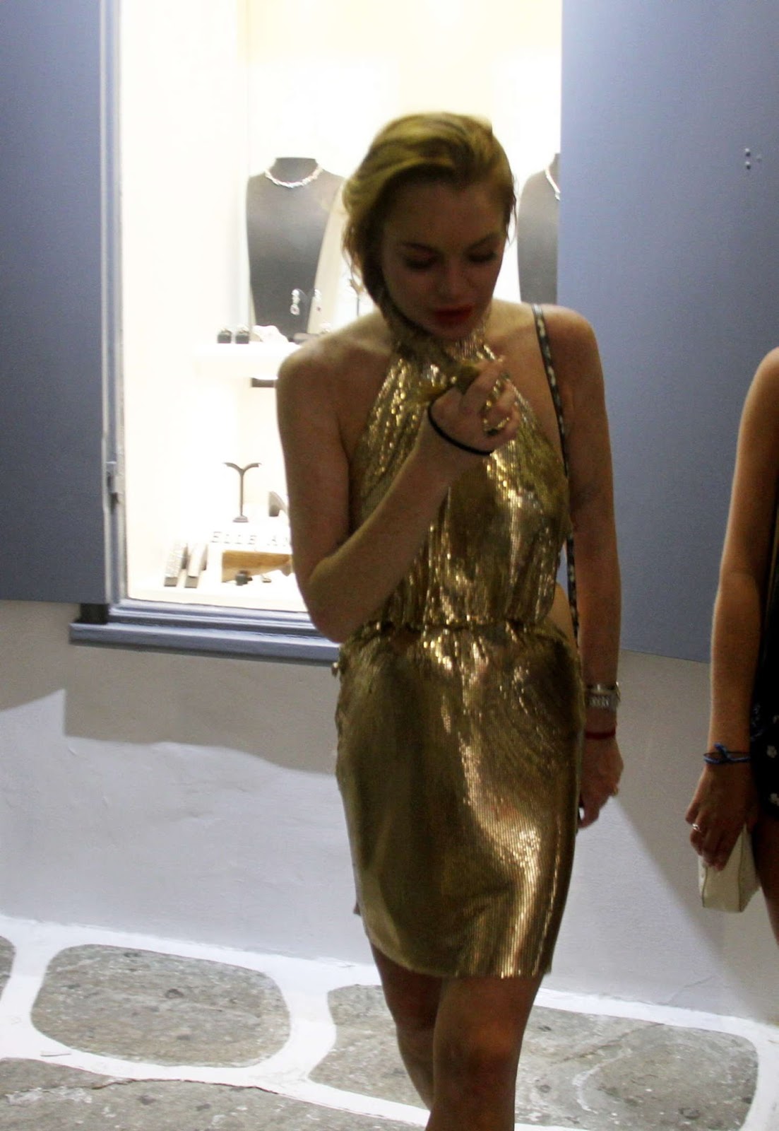 https://mykonosticker.com/wp-content/uploads/2016/07/Lindsay-Lohan-in-Gold-Mini-Dress-02.jpg