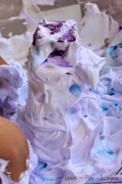 Building shaving cream ice castles with Frozen inspired sensory play.