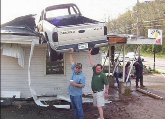 It's not bad enough to have a truck on your roof. But then two dummies have to appear