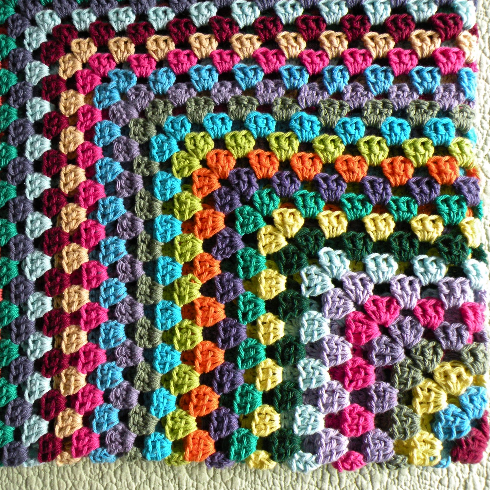 So now I have a new afghan, in a riot of crazy colors, to wrap myself
