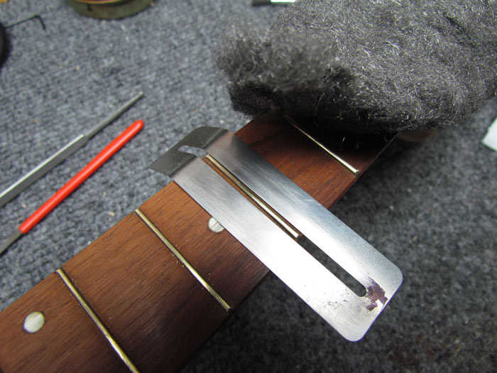 polishing-brass-frets-ukulele.jpg
