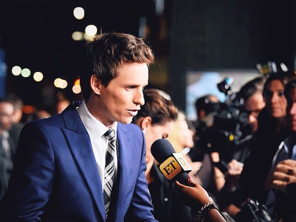 Eddie Redmayne wears Alexander McQueen Pre AW14 blue one-button suit with McQueen shoulder and silk check tie to attend the premiere of ‘The Theory of Everything’ in Los Angeles, on Tuesday 28th October 2014