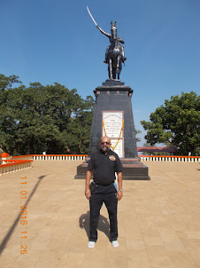 At Pratapgad Fort in front of the statue of Chhatrapati Shivaji.