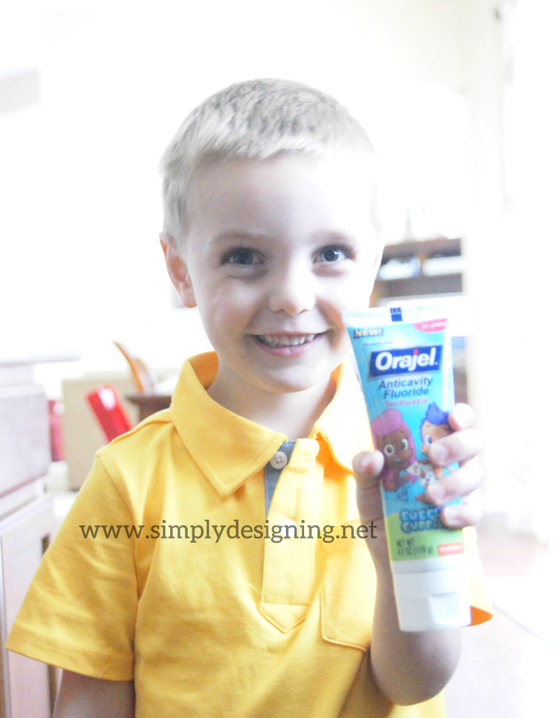 Son+holding+toothpaste | 5 Tips to Make the Dentist Easier for Kids #Orajel #Smilestones #ad | 8 |