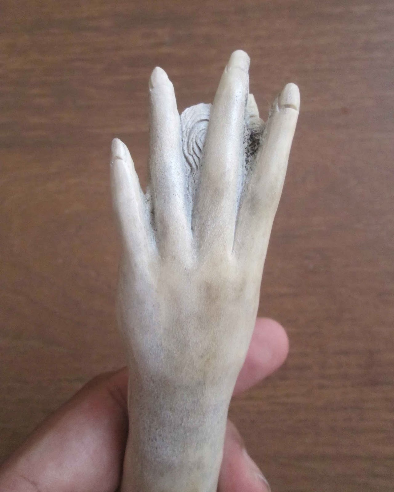 Hand Carved Hand Holds Woman Handle in Antler Hand Carved Hand Holds Woman Handle in Antler
