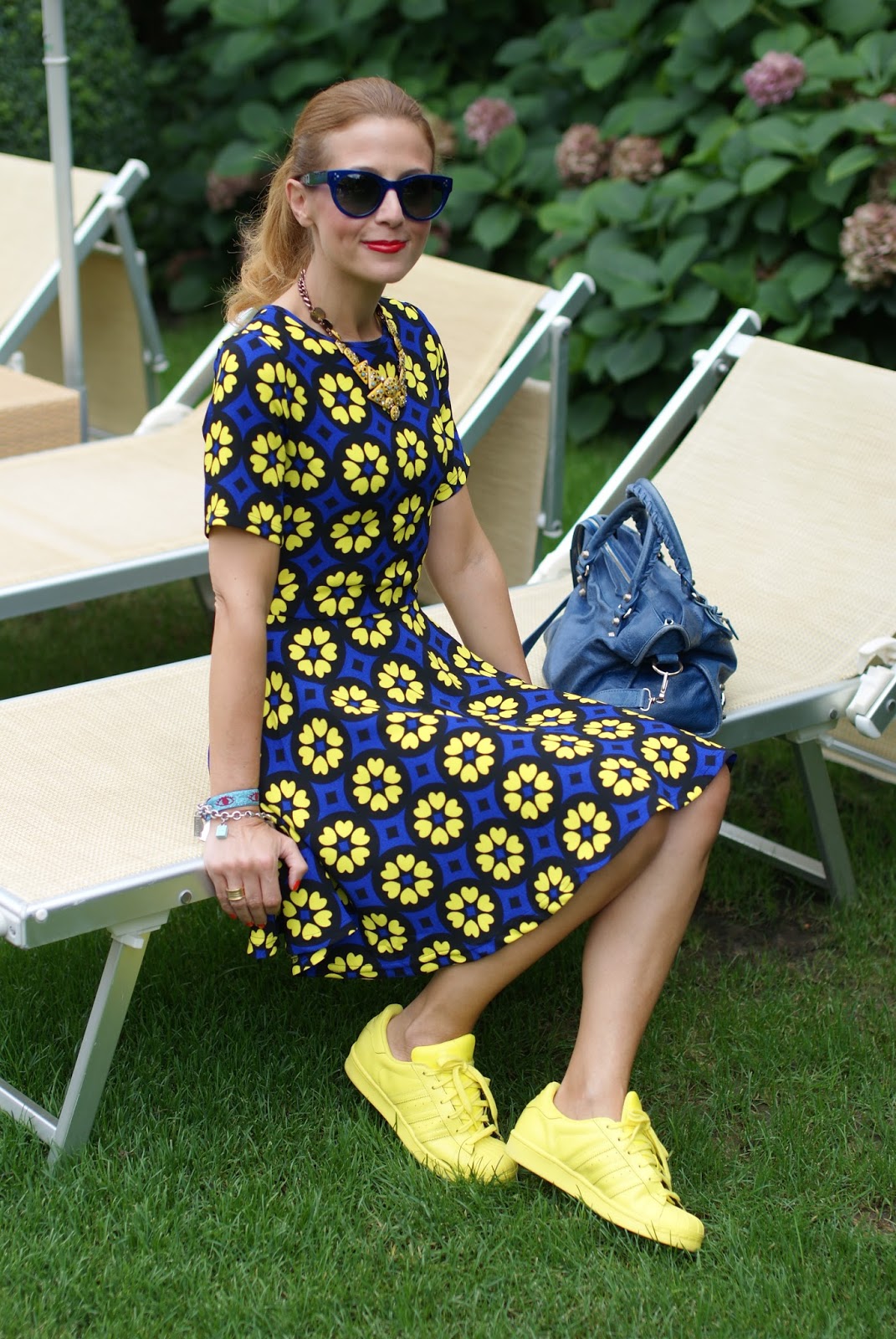 Daisy print skater dress with adidas Supercolor yellow sneakers on Fashion and Cookies fashion blog, fashion blogger girly style