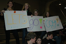 Friends holding up signs for Coy