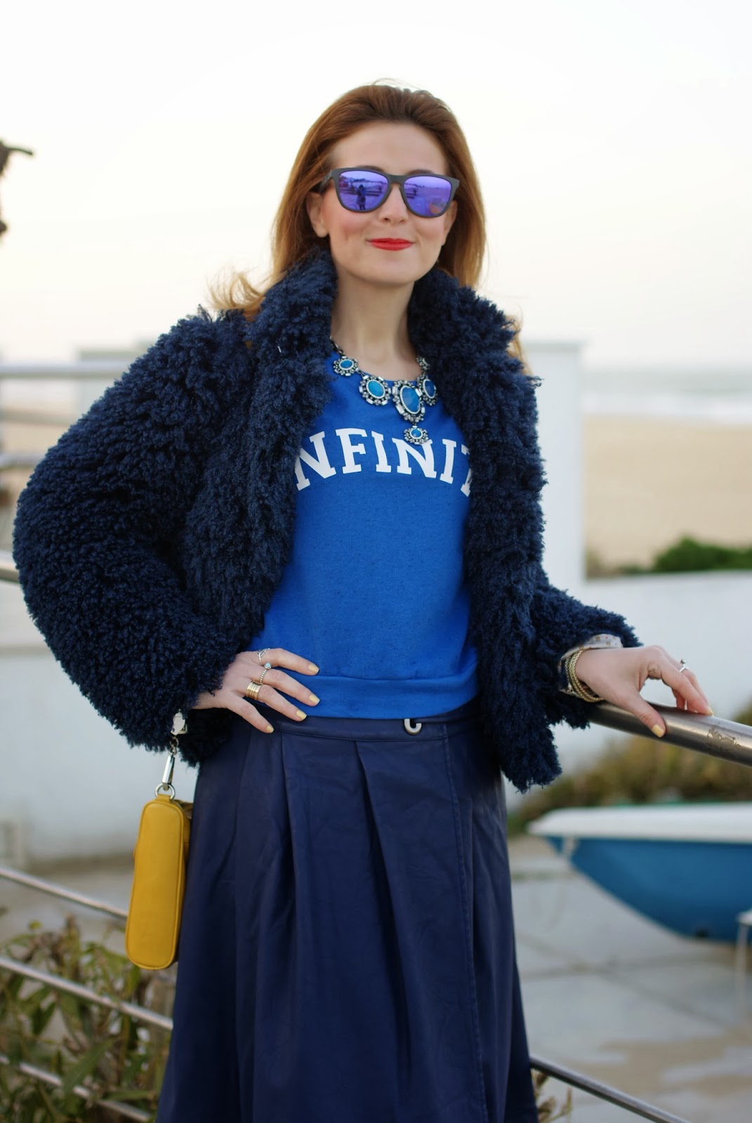 Blue faux fur jacket, Infinity sweatshirt, Oakley blue sunglasses, Fashion and Cookies, fashion blogger