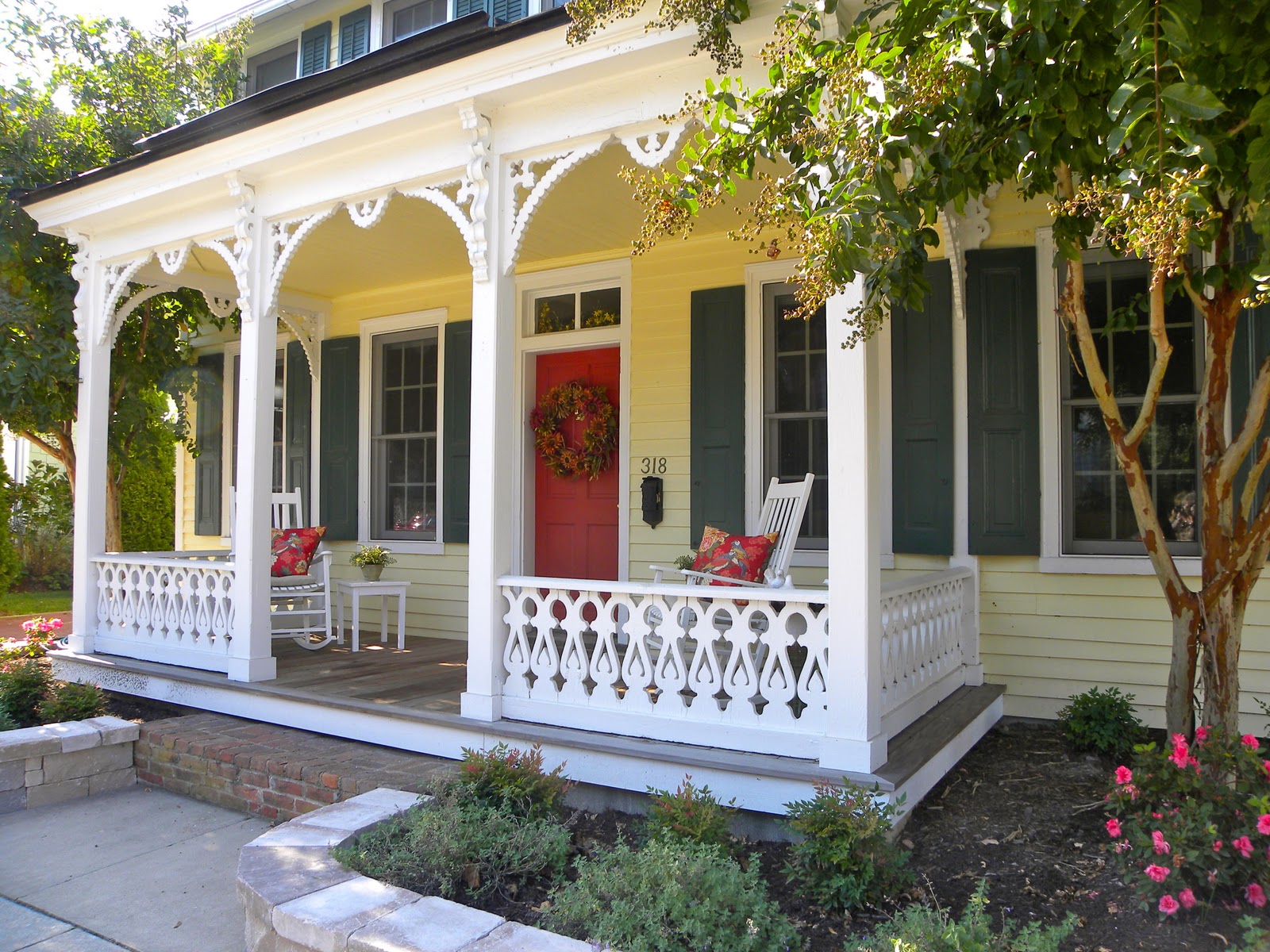 Yellow siding, Essex Green shutters, Red Door, Dark Gray roof