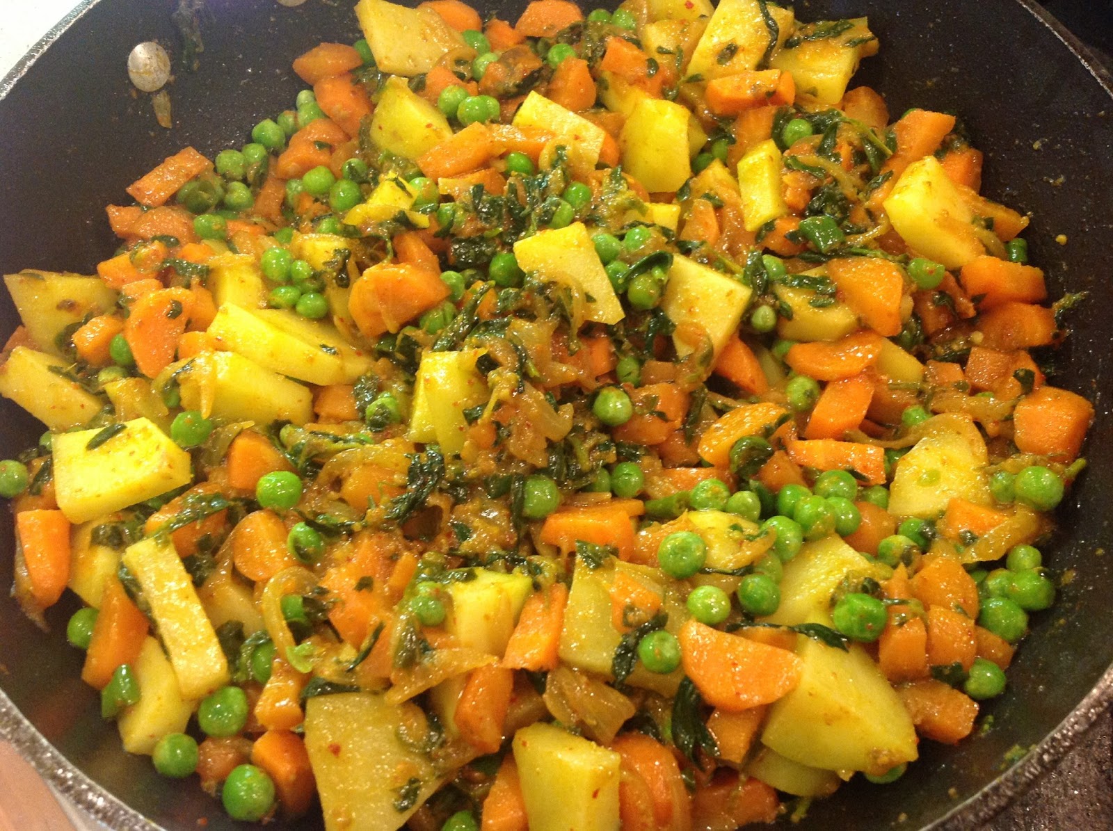 This Muslim Girl Bakes Potatoes, Carrots and Peas Curry