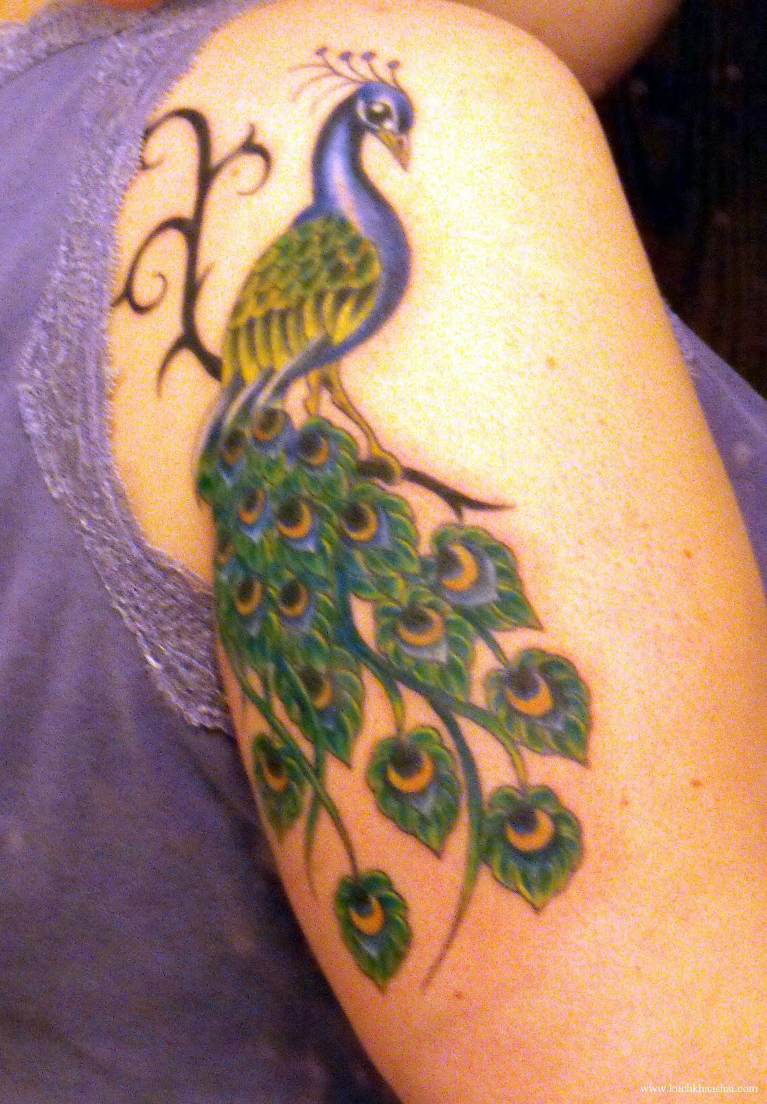 Peacock And Peacock Feather tattoos