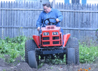 Husband plowing the garden-Vickie's Kitchen and Garden