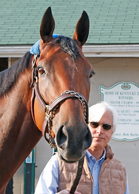 photo of american pharoah and his trainer bob baffert standing in front of the barns