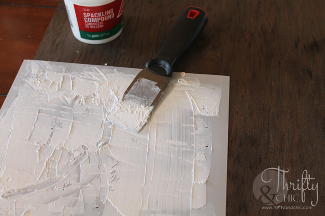 DIY large textured wall art for under $15! Using spackling compound and plywood.