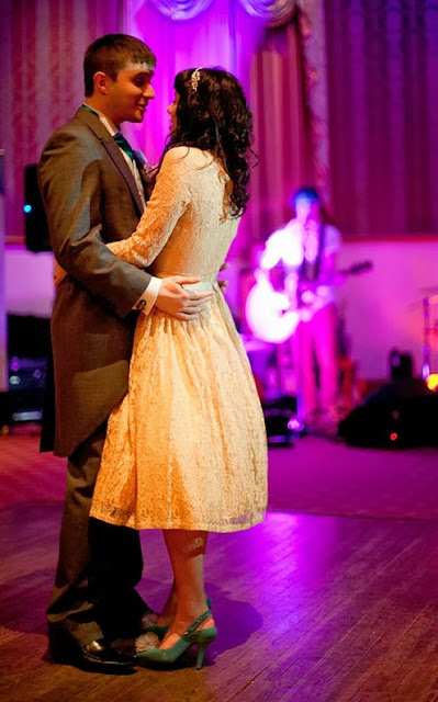 Vintage bride chelsea, in her vintage wedding, on the dancefloor in a pastel dress