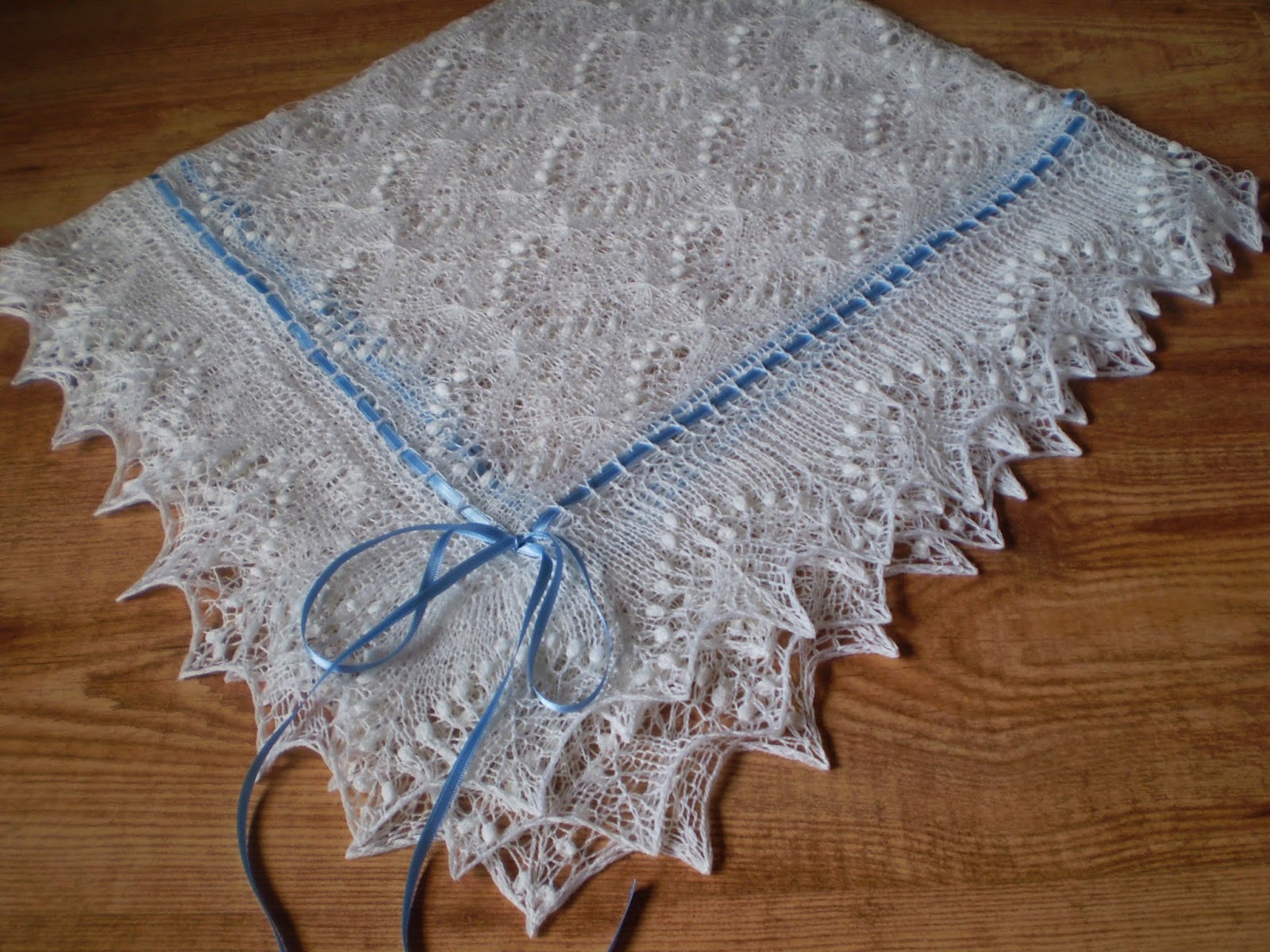 KnitANDlace Christening shawl with blue ribbom