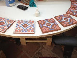 Hand-glazed tile awaiting the kiln Hand-glazed tile awaiting the kiln