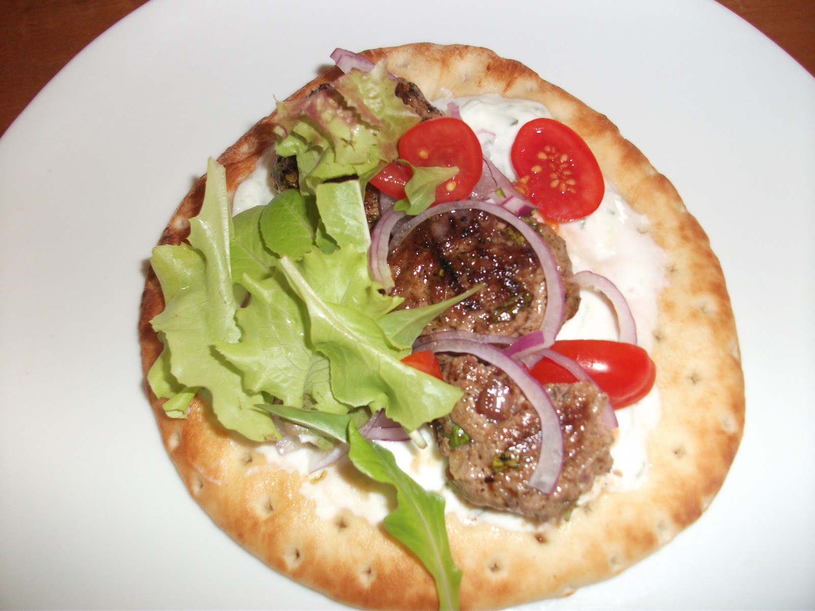 Cold Hands Warm Earth Grilled Lamb Patties with Tzatziki on Pita
