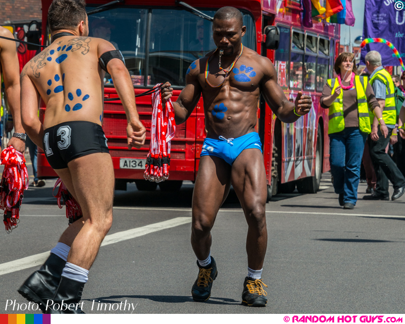 Muscular black guy dancing in gay pride parade Muscular black guy dancing in gay pride parade